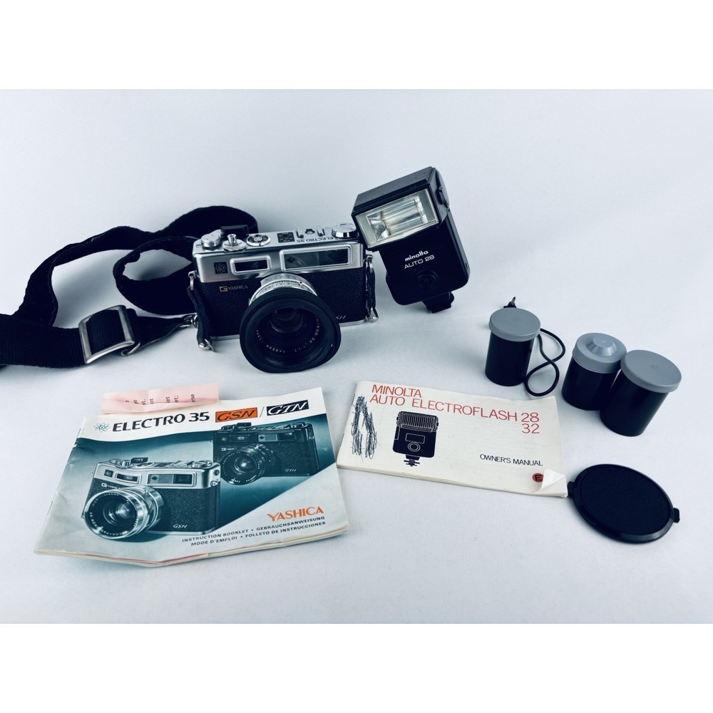 Yashica Vintage Electro 35 GSN Camera & Minolta Electroflash 28 & Film & Books